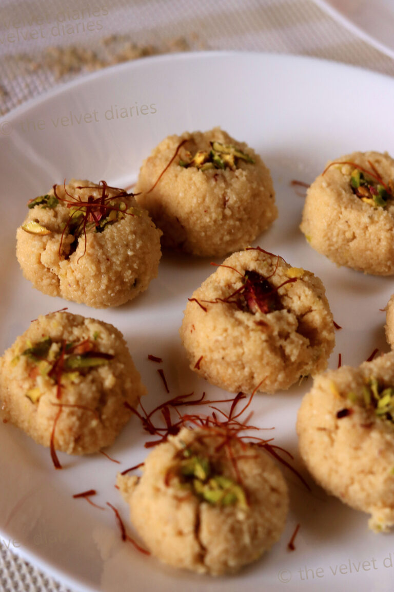 Freshly made Mava Pedha topped with saffron strands, enhancing its royal look and flavor.