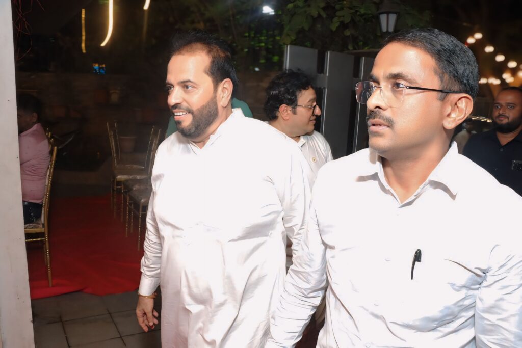 Regional leader interacting with event host during ceremony
