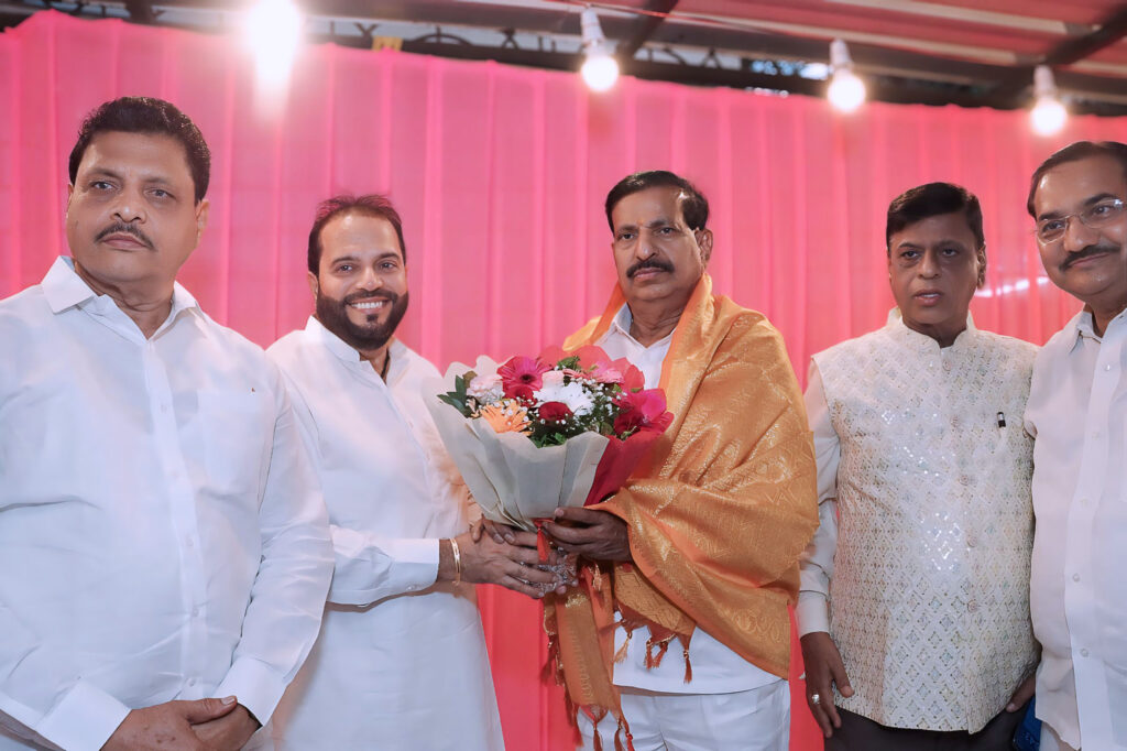 Regional leader interacting with event host during ceremony