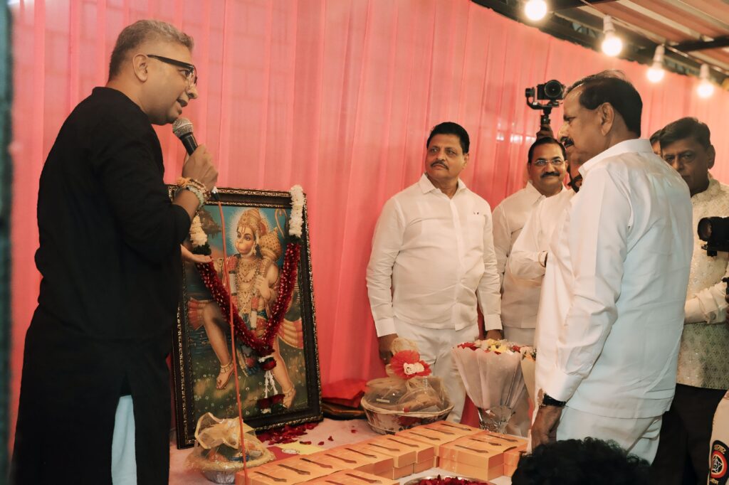 Religious setup with floral decor and Hanuman idol at the event
