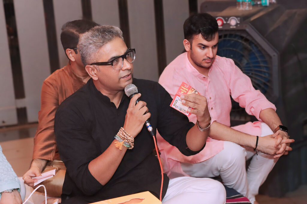 Devotees singing Hanuman Chalisa during the spiritual gathering
