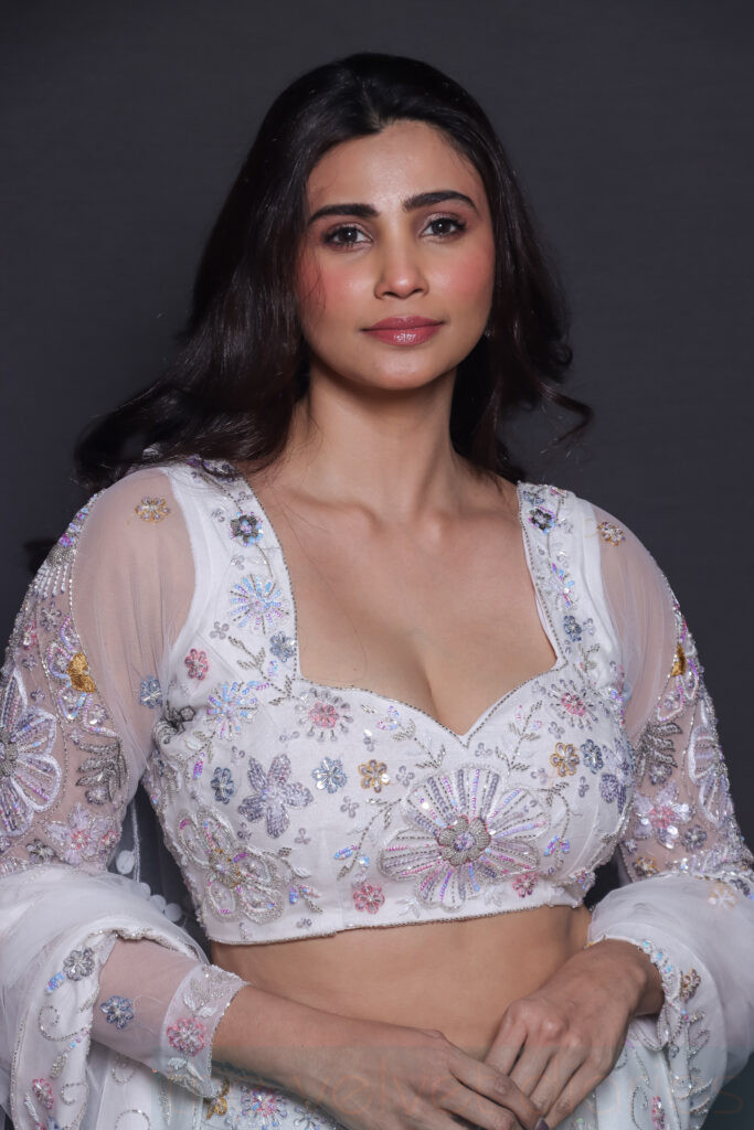 Celebrity runway appearance captured at a fashion event