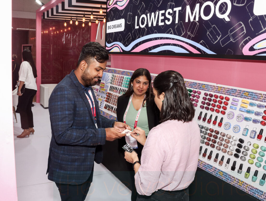 Business interaction at exhibition booth during trade fair in Mumbai