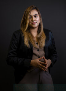 Professional corporate headshot of female professional in Mumbai with dark studio background