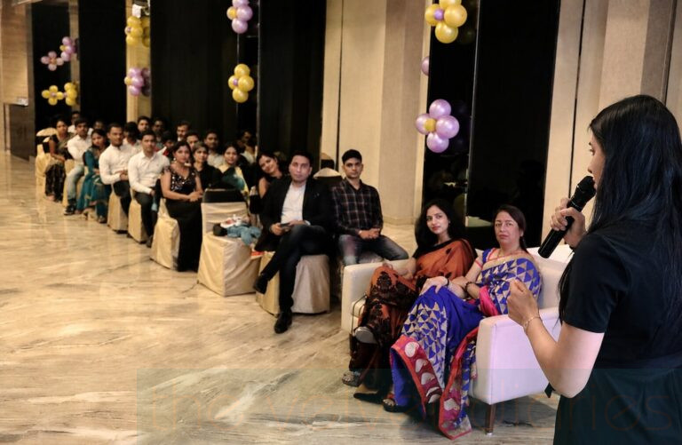 Business professionals interacting during corporate anniversary networking event in Mumbai