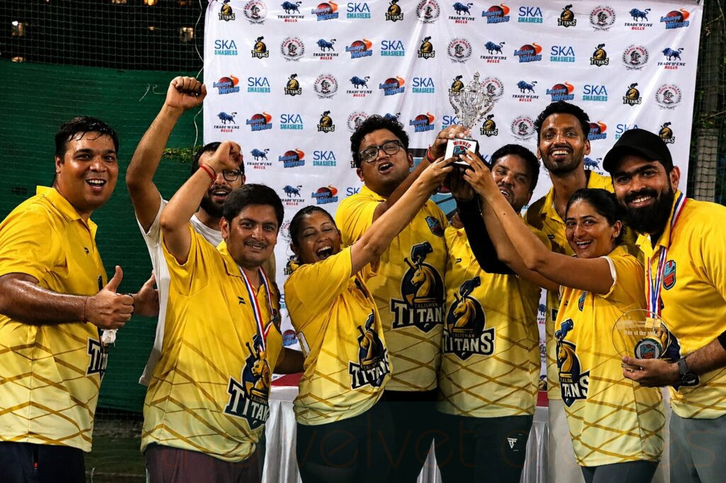 Winning corporate cricket team celebration during Mumbai networking event