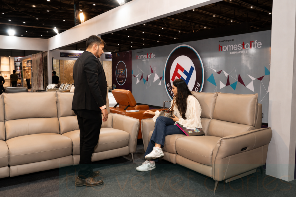 Business interaction captured during a corporate furniture exhibition event