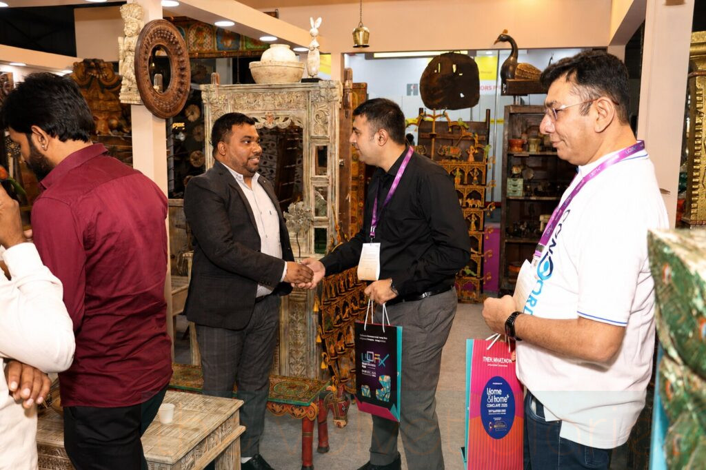 Business networking interaction photographed during corporate trade fair event in Mumbai