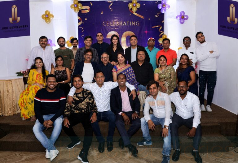 Corporate team group photograph during business anniversary celebration in Mumbai