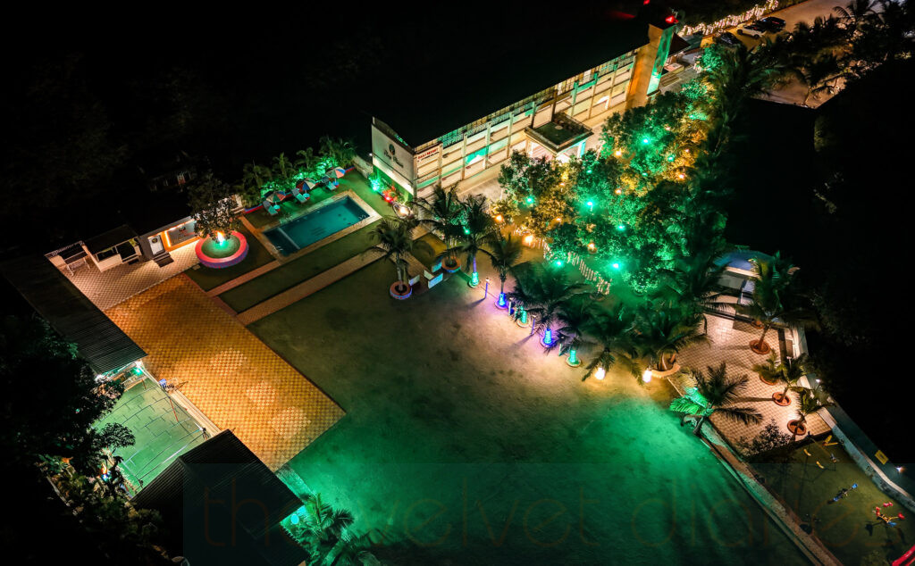 Night drone photography of illuminated resort and hospitality venue in Maharashtra