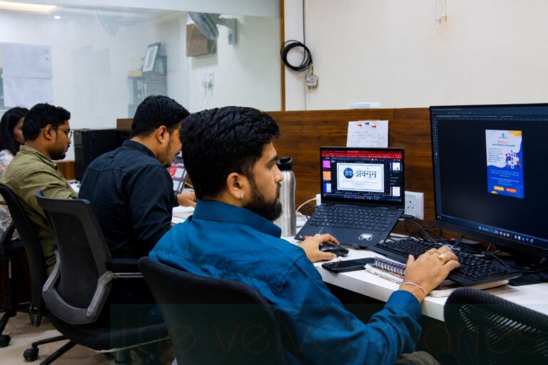 Employees working inside a professional corporate office workspace environment