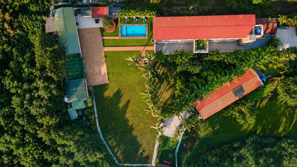 Architectural drone view of commercial resort property and landscaped hospitality environment