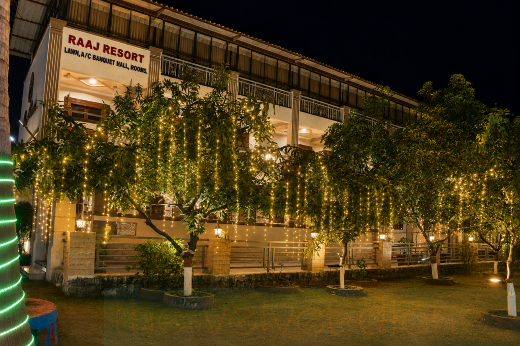 Exterior night photography of luxury resort property with decorative lighting