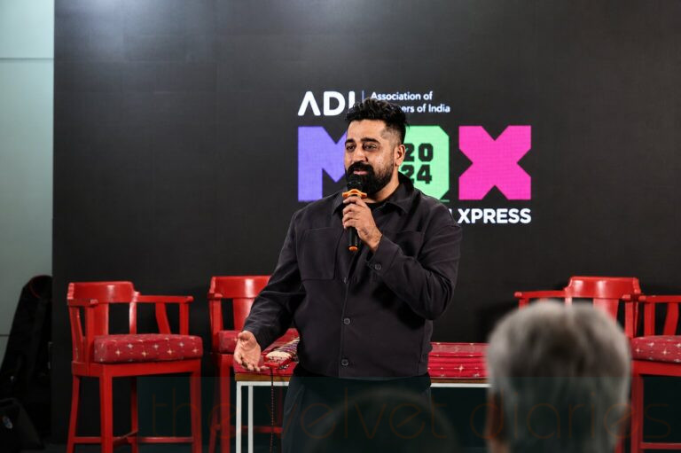 Keynote speaker presenting during a corporate conference photographed by The Velvet Diaries in Mumbai.