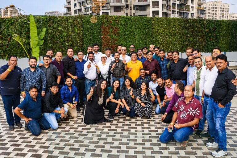 Corporate team group photograph captured during a business networking event in Lower Parel, Mumbai by The Velvet Diaries.