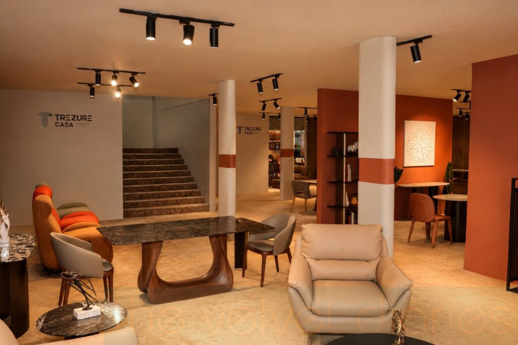 Interior view of a premium branded furniture exhibition booth photographed at NESCO Exhibition Centre Goregaon Mumbai.