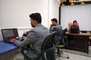 Corporate team photography in BKC Mumbai showing professionals working together in a business office