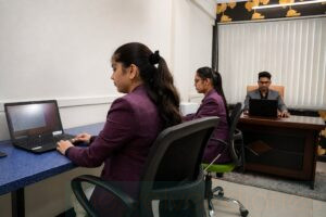 Corporate workplace photography in BKC Mumbai showing employees working in a professional business office
