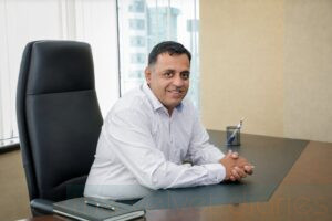 Executive business portrait of a senior professional seated at his office desk in Mumbai