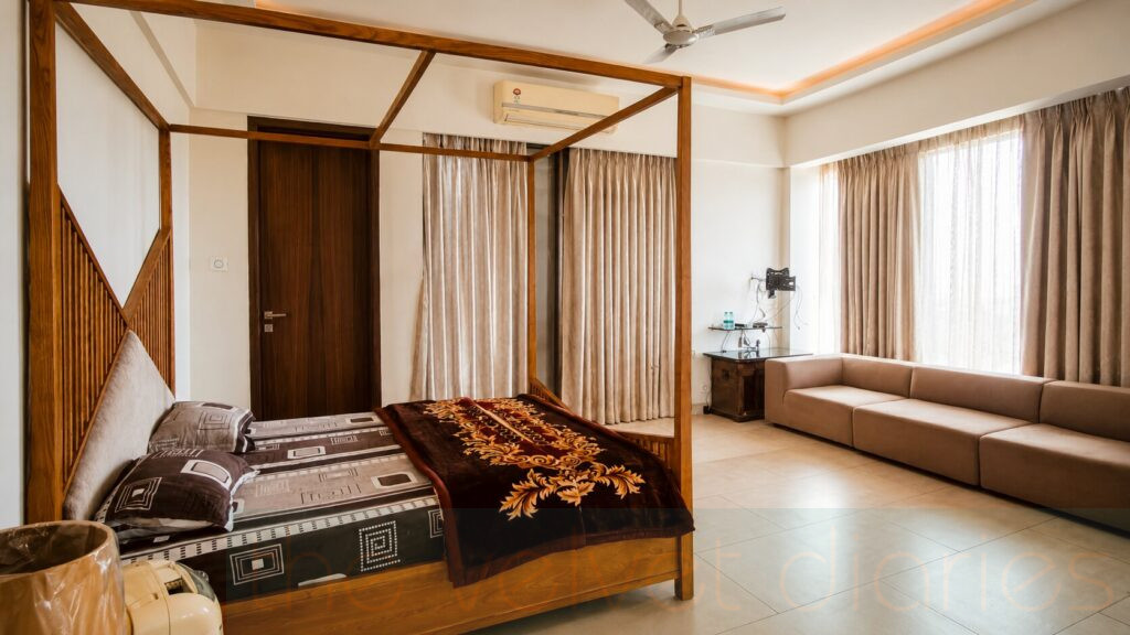 Luxury real estate interior photography in Powai Mumbai featuring an elegant bedroom and living room