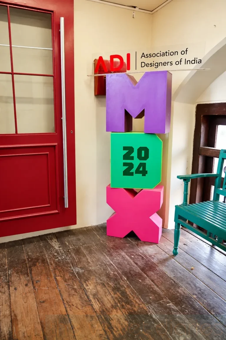 Design event branding photography featuring the colourful ADI Mumbai Design Xpress 2024 installation at the Association of Designers of India event.