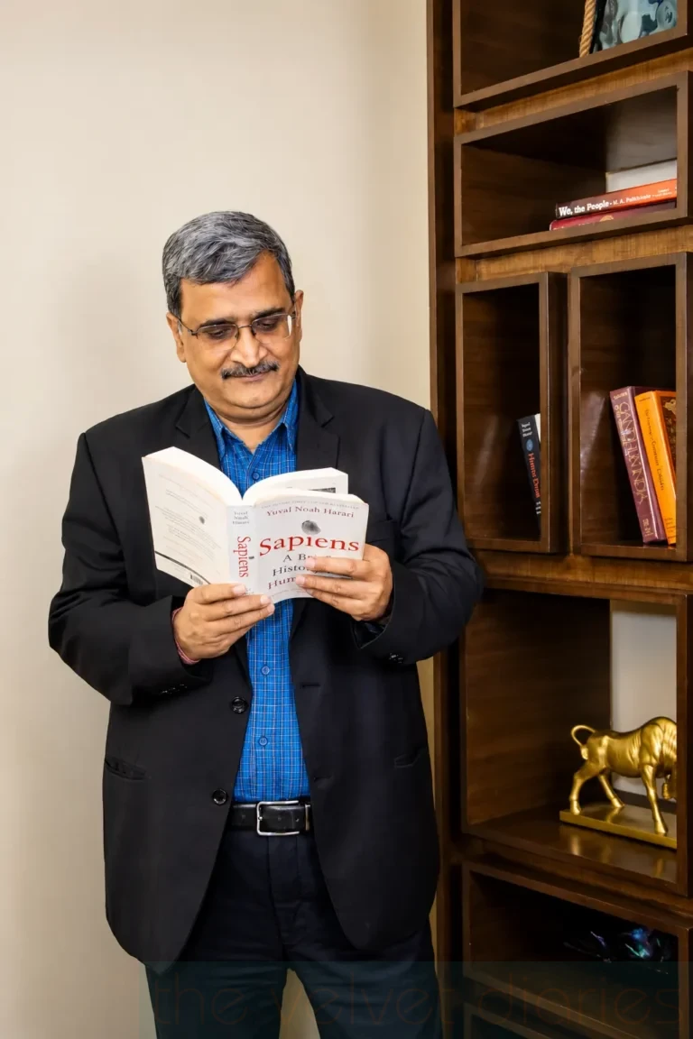 Environmental business portrait of a professional reading in a corporate setting in Lower Parel Mumbai